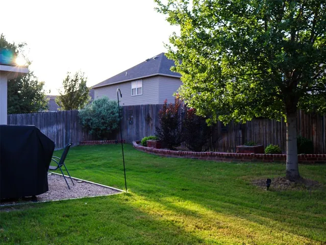 a view of a back yard of the house