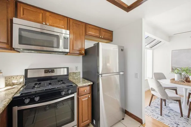 a kitchen with a stove and a microwave