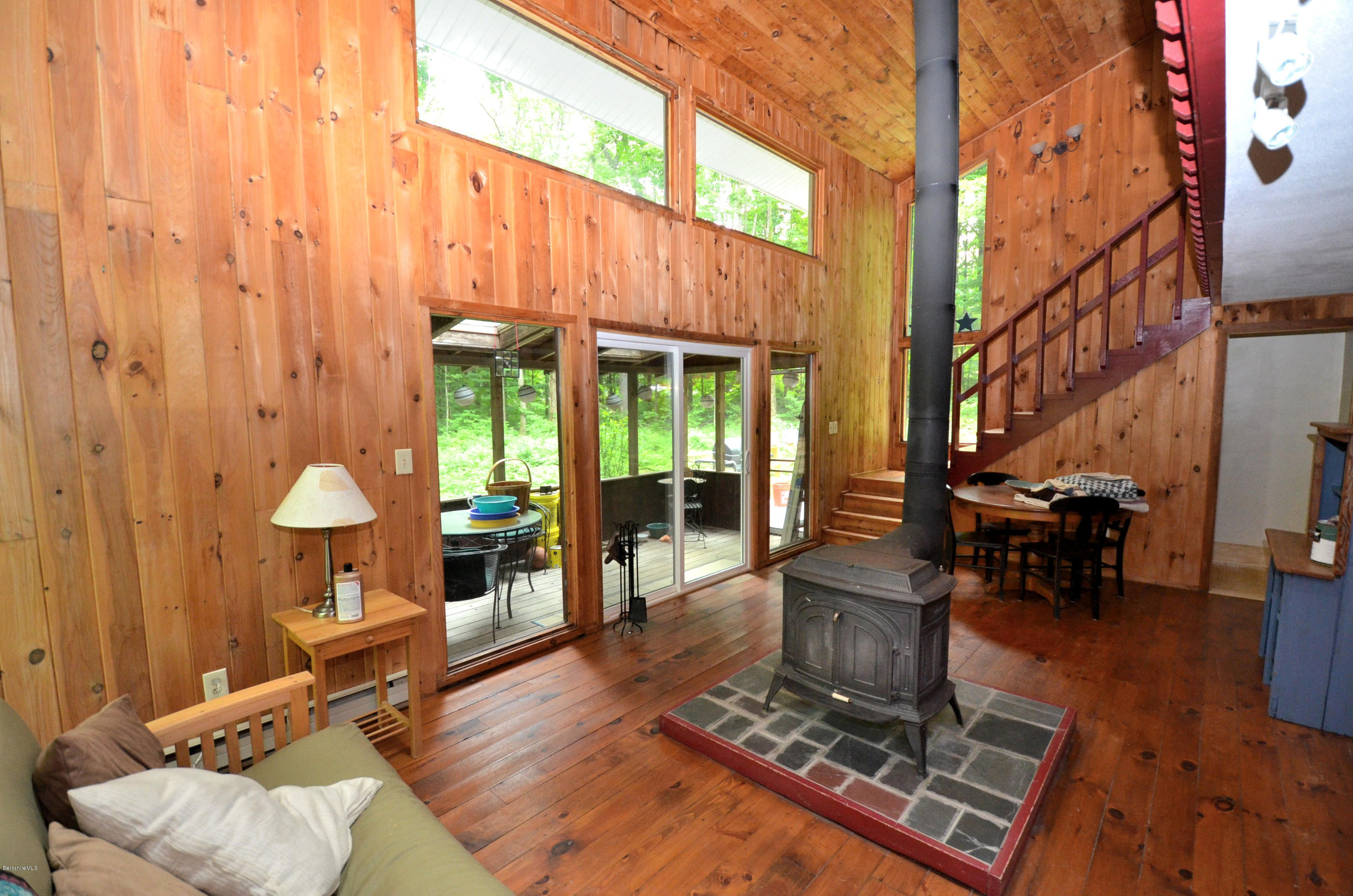 204 Stebbins Road Otis, MA 01253 - Photo 3 of 9 a living room with furniture a window and a fireplace