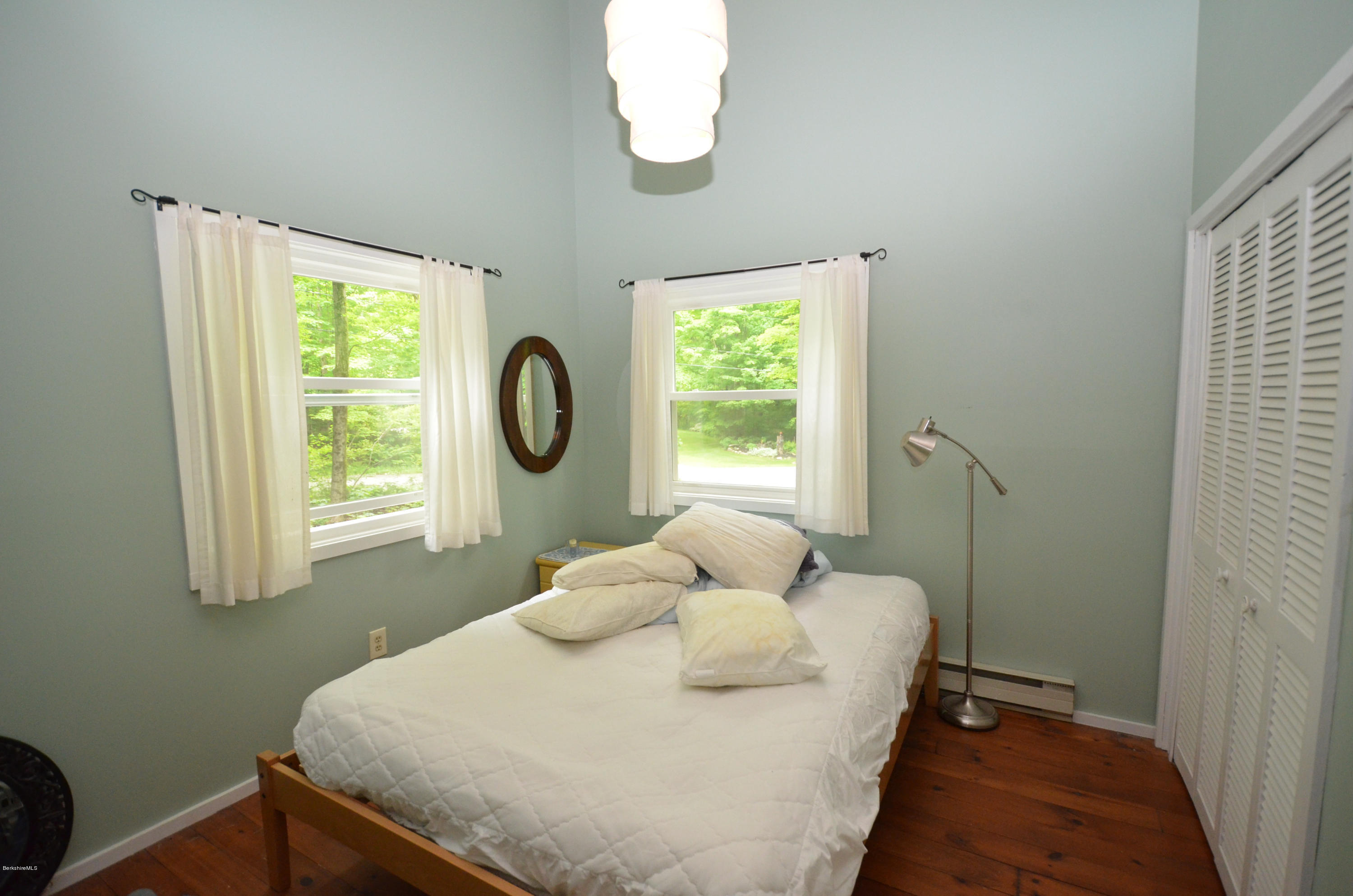 204 Stebbins Road Otis, MA 01253 - Photo 7 of 9 a bedroom with a bed and a window