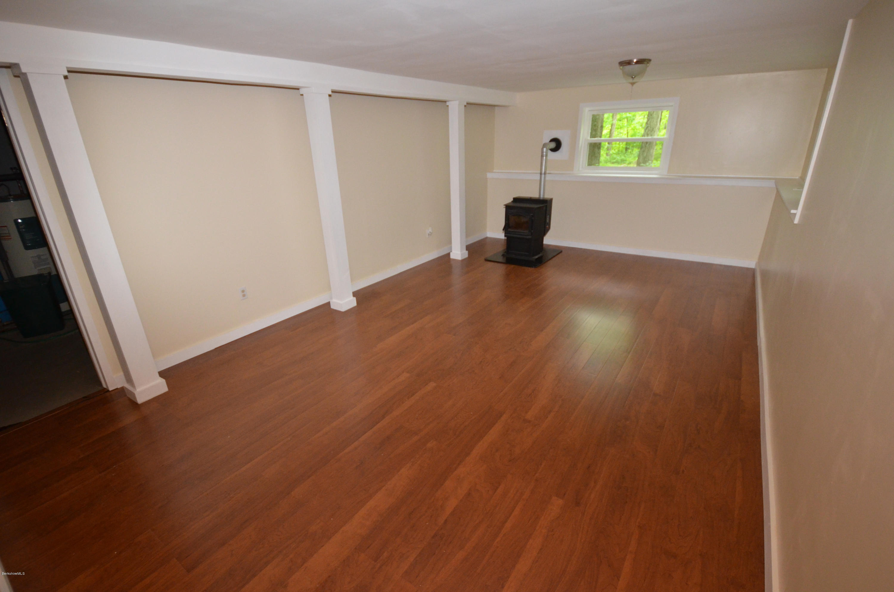 204 Stebbins Road Otis, MA 01253 - Photo 9 of 9 wooden floor in an empty room with a window