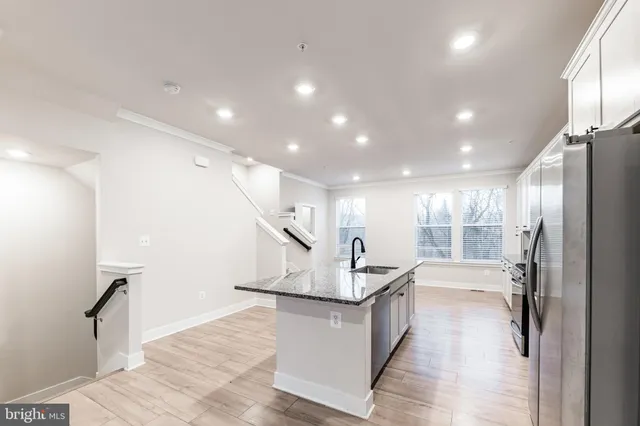 a bathroom with a sink a mirror and a shower