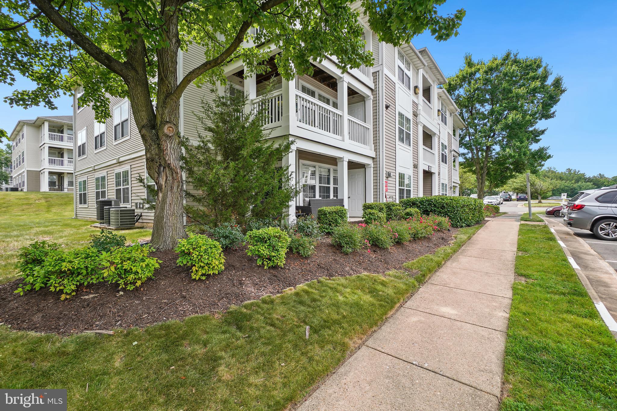 14151 Cuddy Loop, Unit 101 Woodbridge, VA 22193 - Photo 32 of 45 a front view of a multi story residential apartment buildings