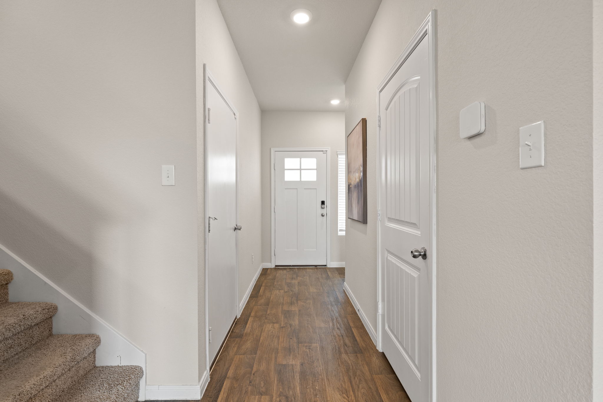281 Jayden Drive Kyle, TX 78640 - Photo 5 of 36 Entryway featuring wood-finish flooring, light neutral wall paint, and recessed lighting