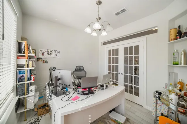 a living room with lots of furniture and a chandelier