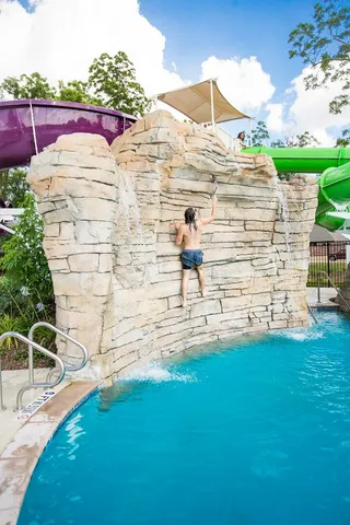 a view of a balcony with a yard