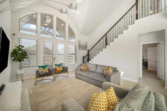 a living room with furniture or couch and a potted plant