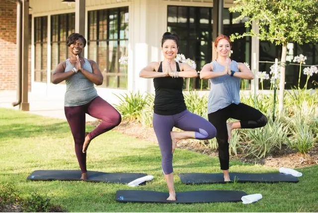 a swimming pool with outdoor seating and yard