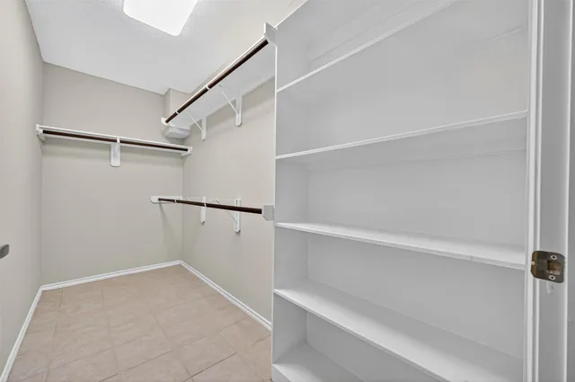 a view of an empty walk in closet