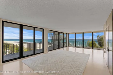 a view of a big room with windows and a balcony