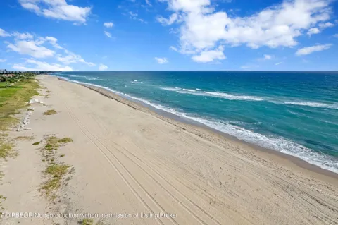 a swimming pool with outdoor seating and yard