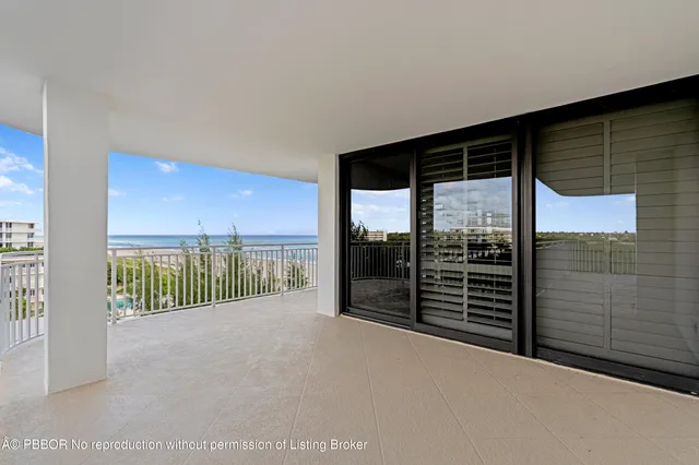 a view of a porch with wooden floor