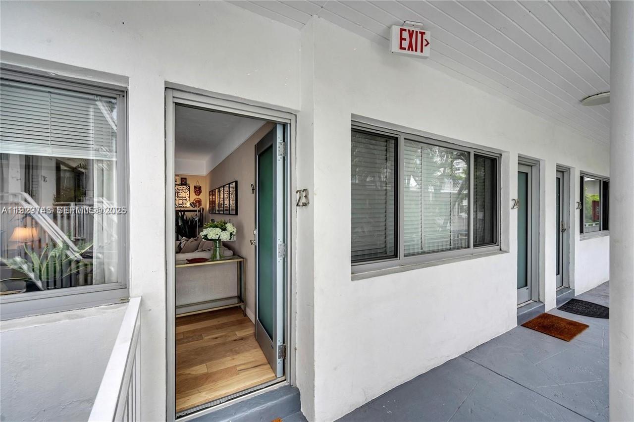 1840 James Avenue, Unit 23 Miami Beach, FL 33139 - Photo 2 of 10 a view of a livingroom with wooden floor and furniture
