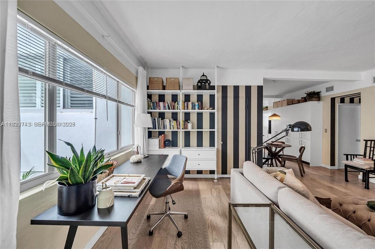 1840 James Avenue, Unit 23 Miami Beach, FL 33139 - Photo 4 of 10 a view of a workspace with furniture and a potted plant