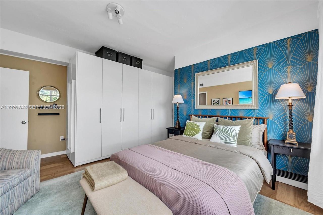 1840 James Avenue, Unit 23 Miami Beach, FL 33139 - Photo 8 of 10 a bedroom with bed and wooden floor