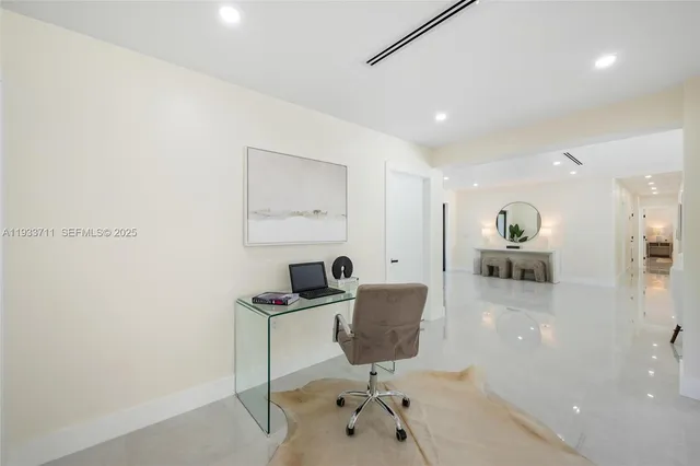 a workspace with furniture and view of bathroom