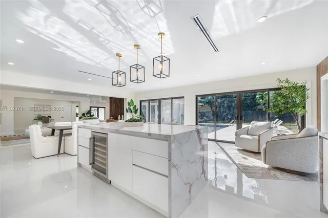 a kitchen with furniture and window
