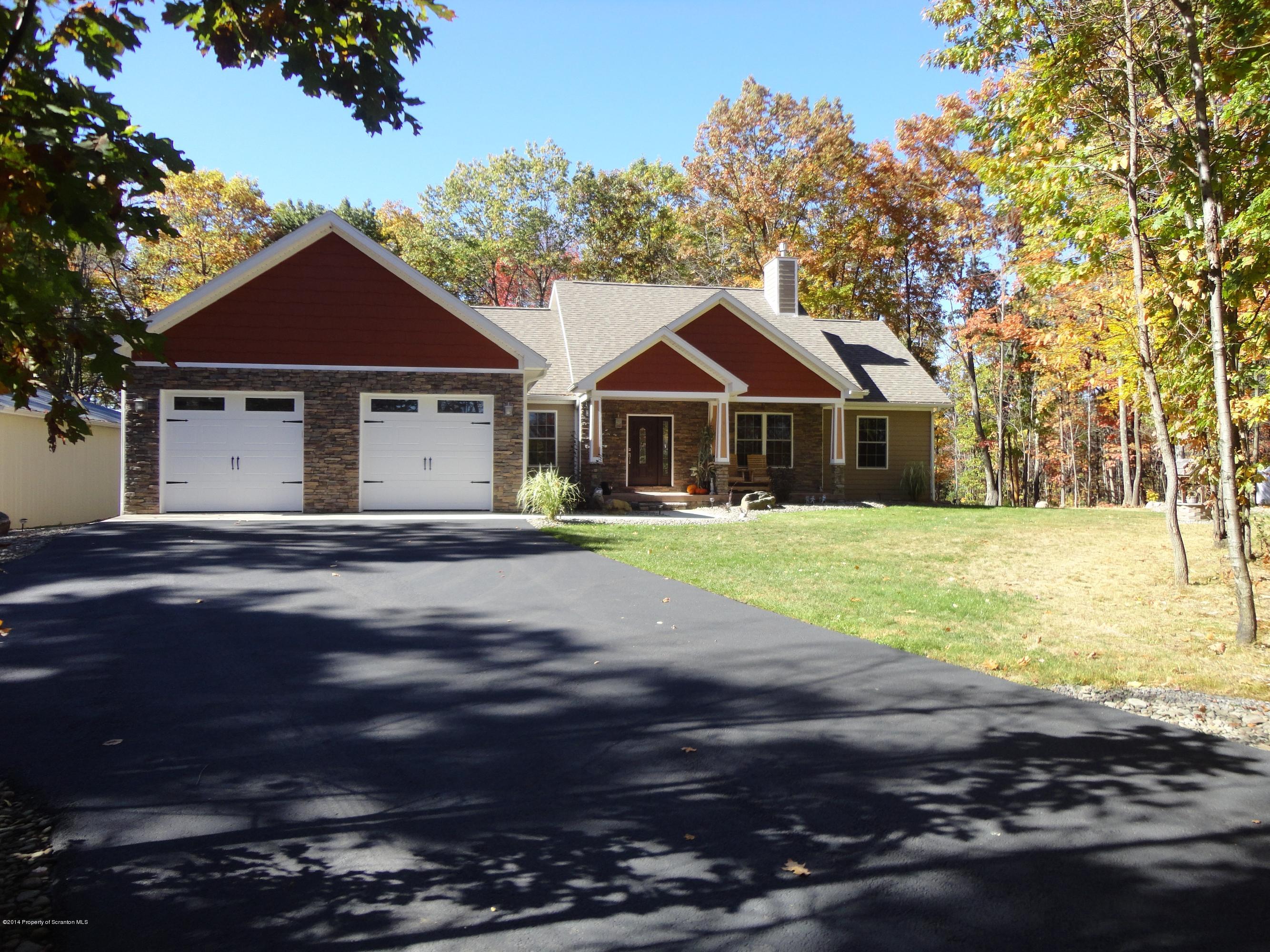 910 Line Road Lake Ariel, PA 18436 - Photo 1 of 48 a front view of a house with yard