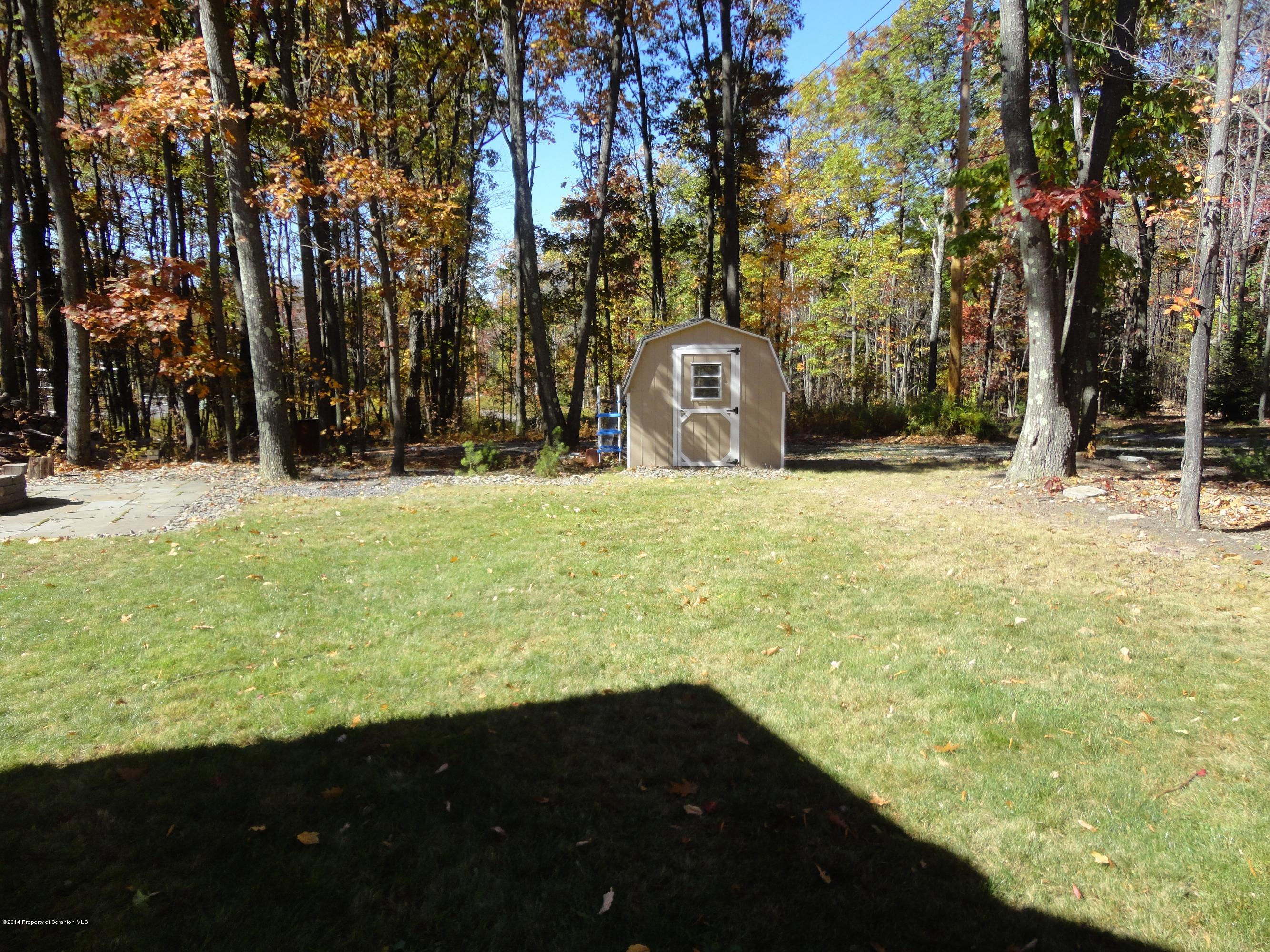 910 Line Road Lake Ariel, PA 18436 - Photo 14 of 48 a view of a yard with an outdoor space