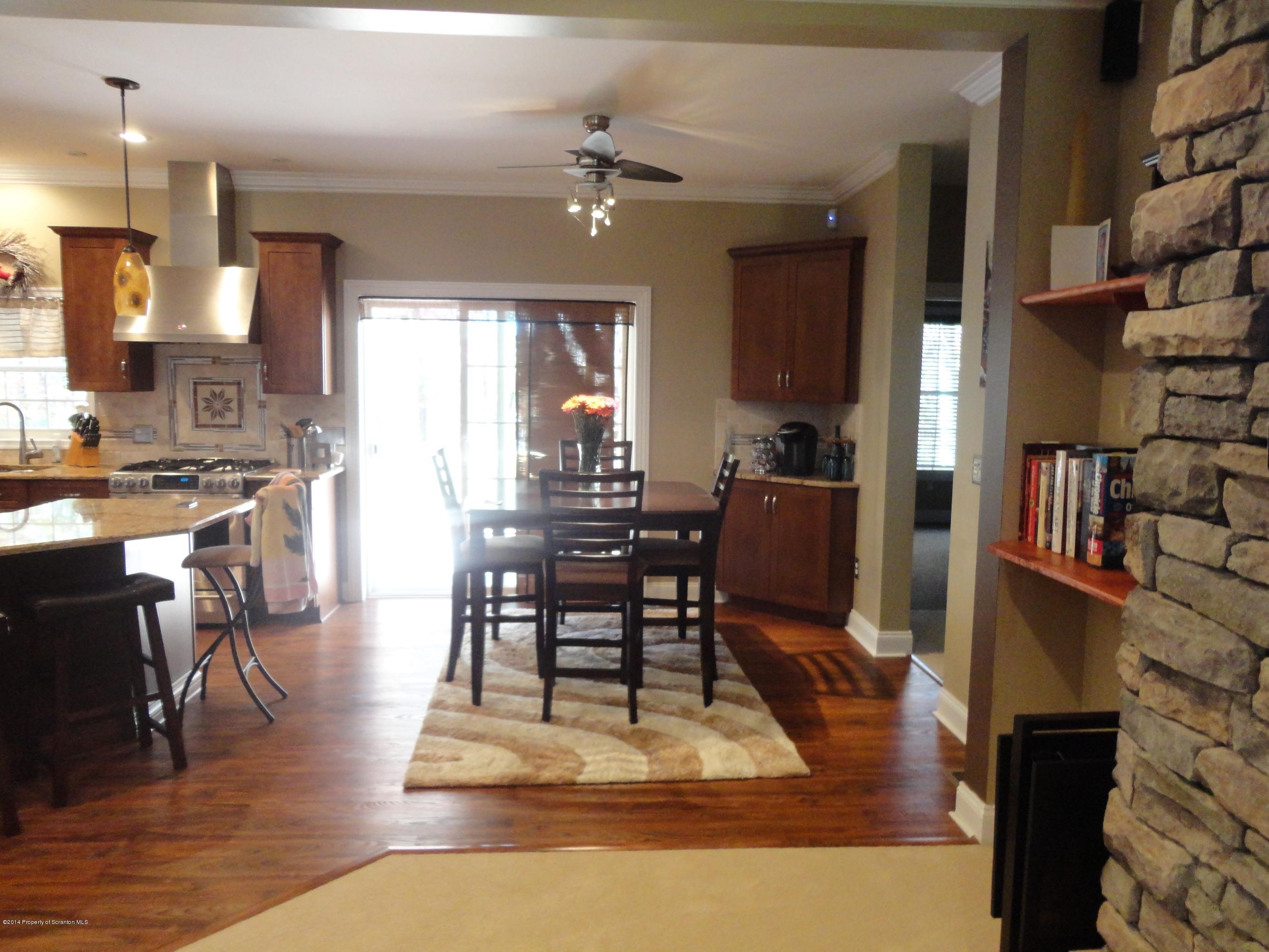 910 Line Road Lake Ariel, PA 18436 - Photo 18 of 48 a living room with furniture a rug and a chandelier