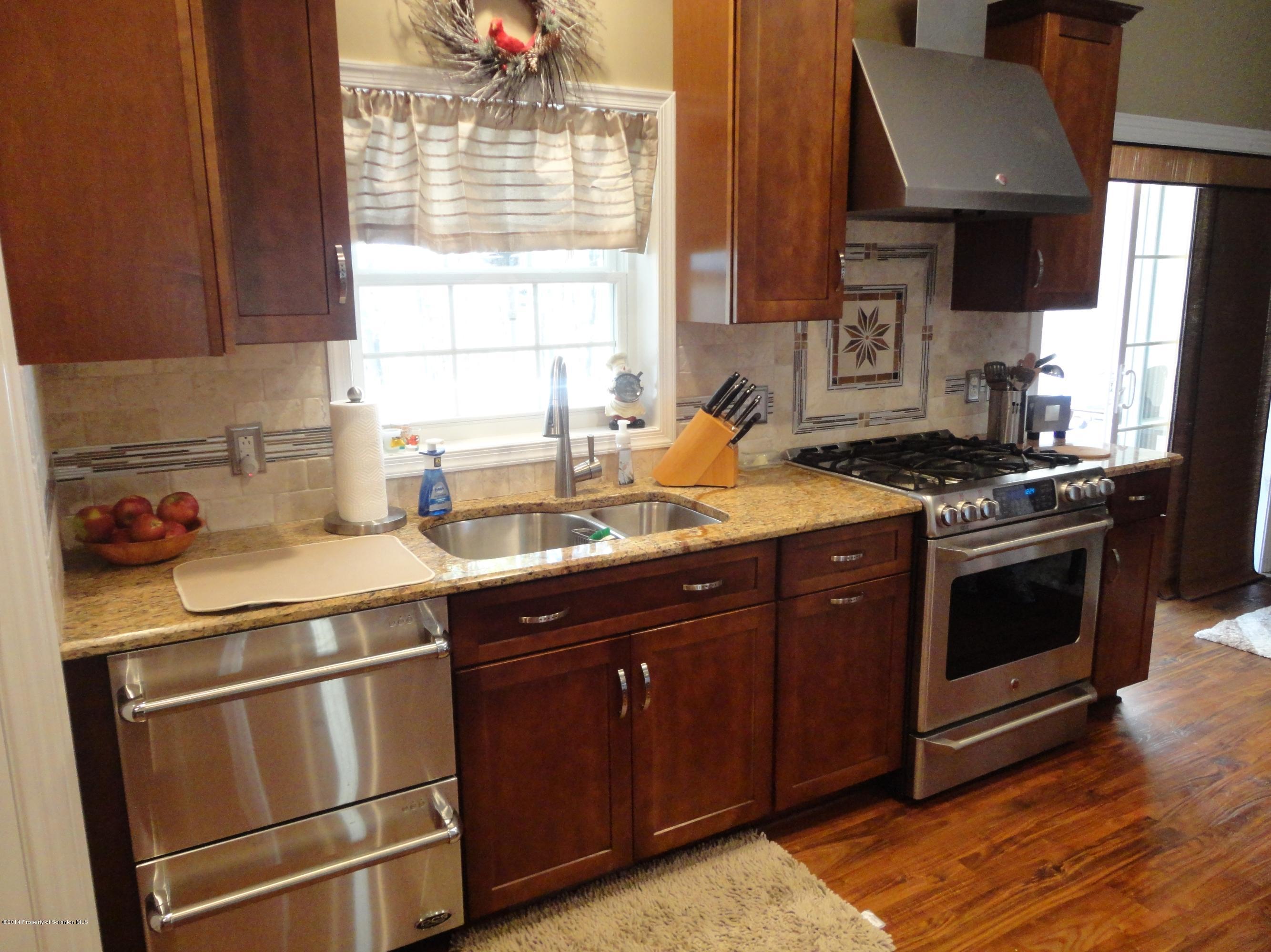 910 Line Road Lake Ariel, PA 18436 - Photo 20 of 48 a kitchen with a sink stove and cabinets