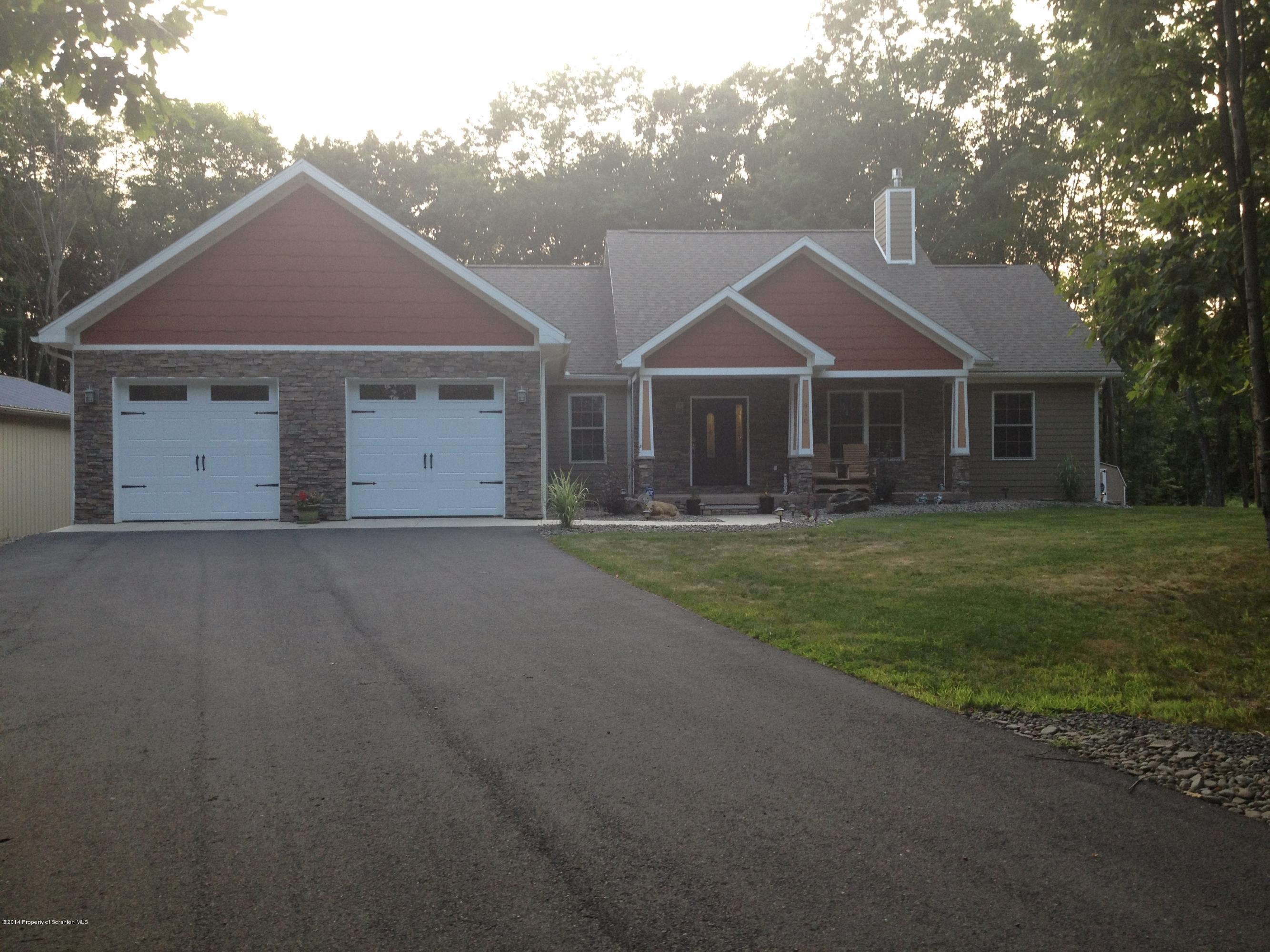 910 Line Road Lake Ariel, PA 18436 - Photo 2 of 48 a front view of house with yard and green space