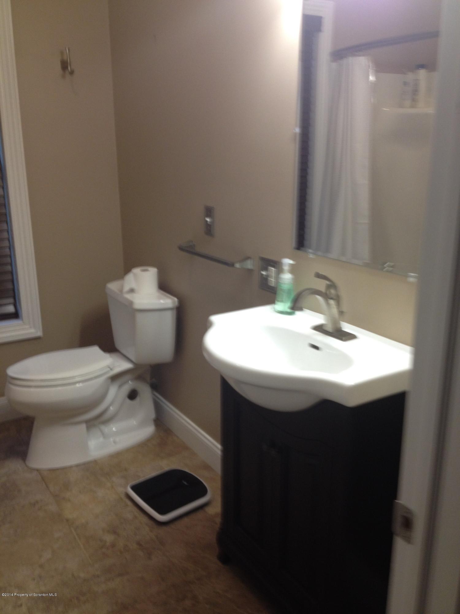 910 Line Road Lake Ariel, PA 18436 - Photo 27 of 48 a bathroom with a sink toilet and a mirror
