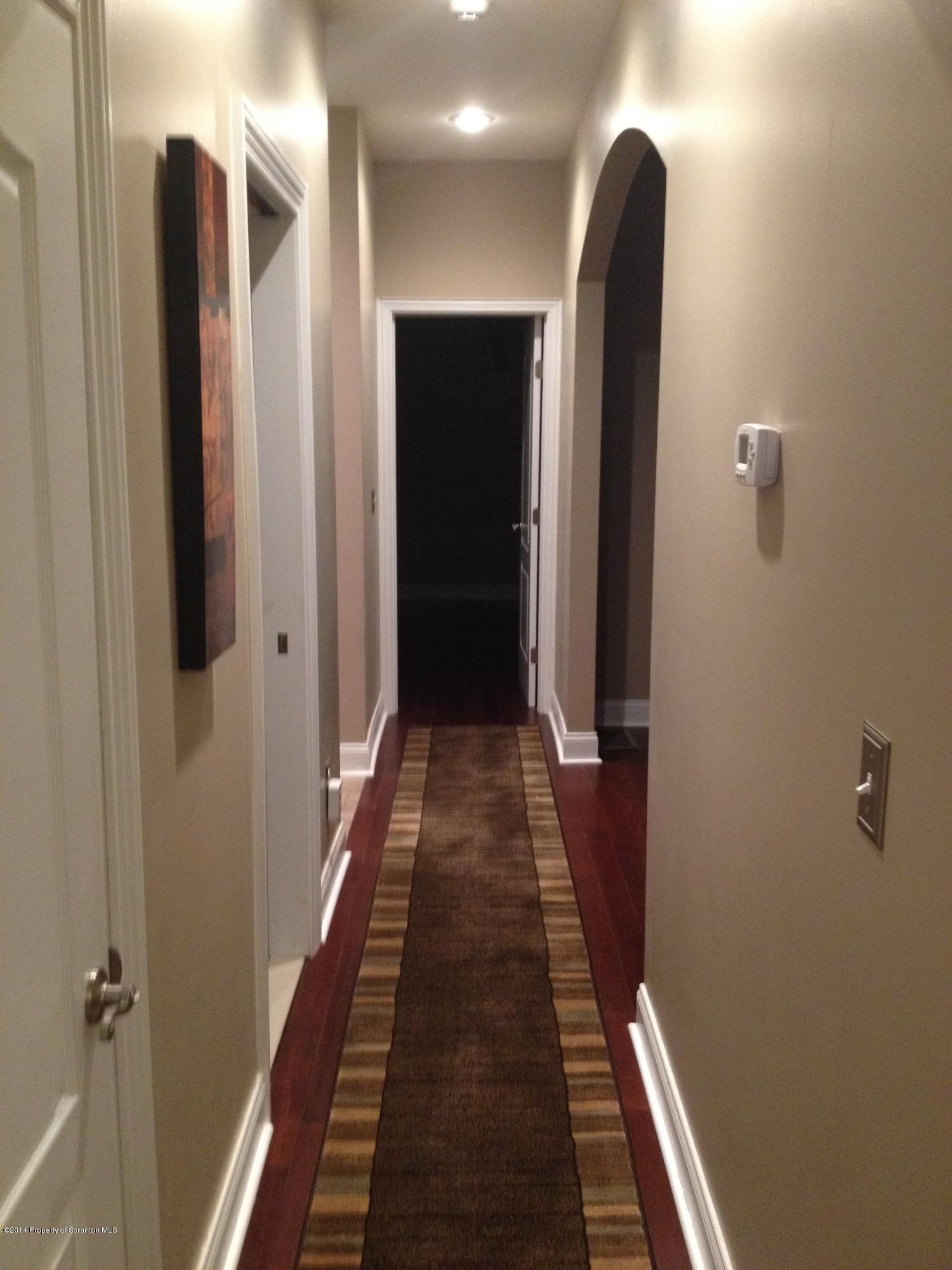 910 Line Road Lake Ariel, PA 18436 - Photo 30 of 48 a view of a hallway with wooden floor