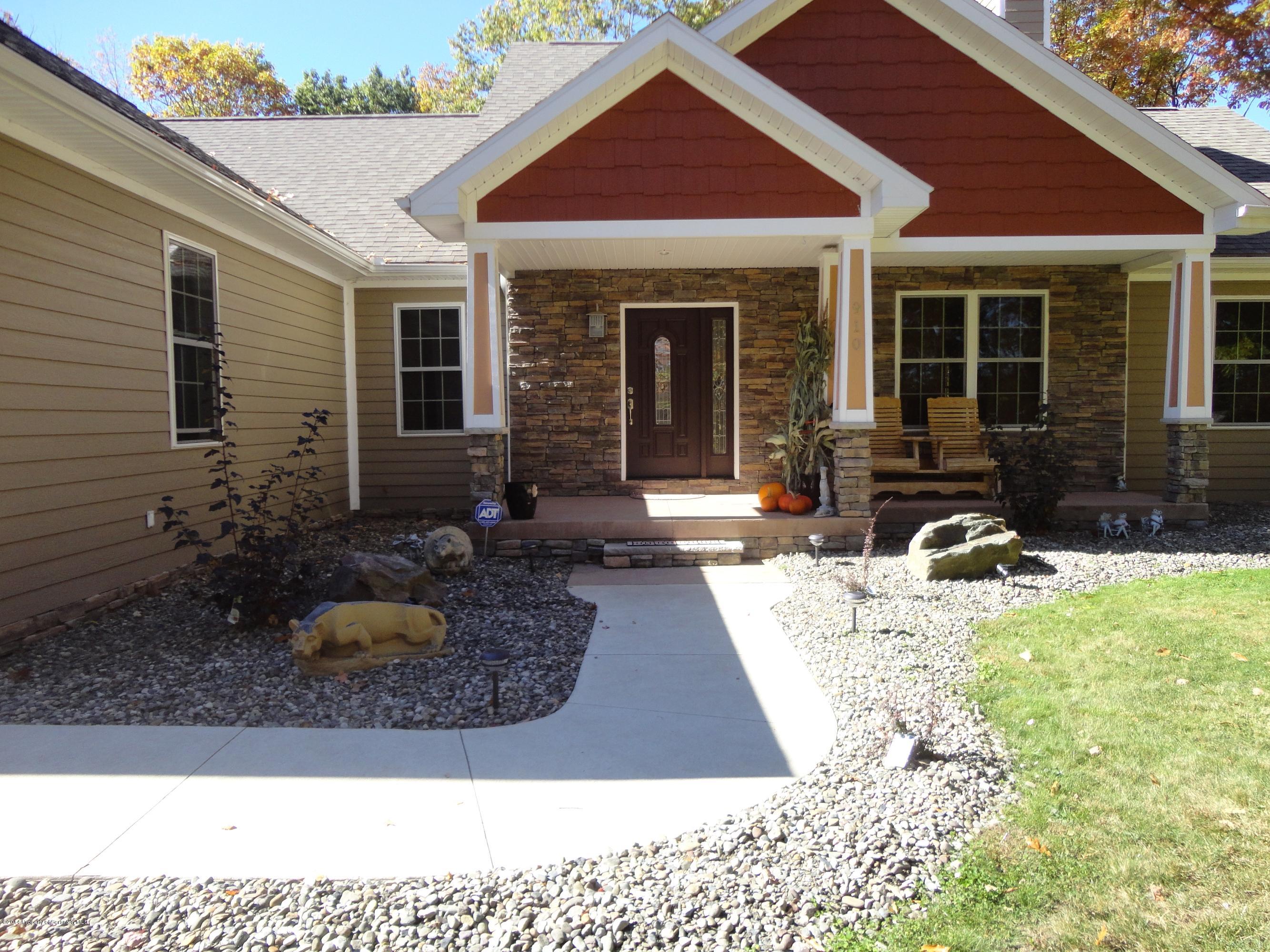 910 Line Road Lake Ariel, PA 18436 - Photo 3 of 48 a view of a house with backyard and sitting area