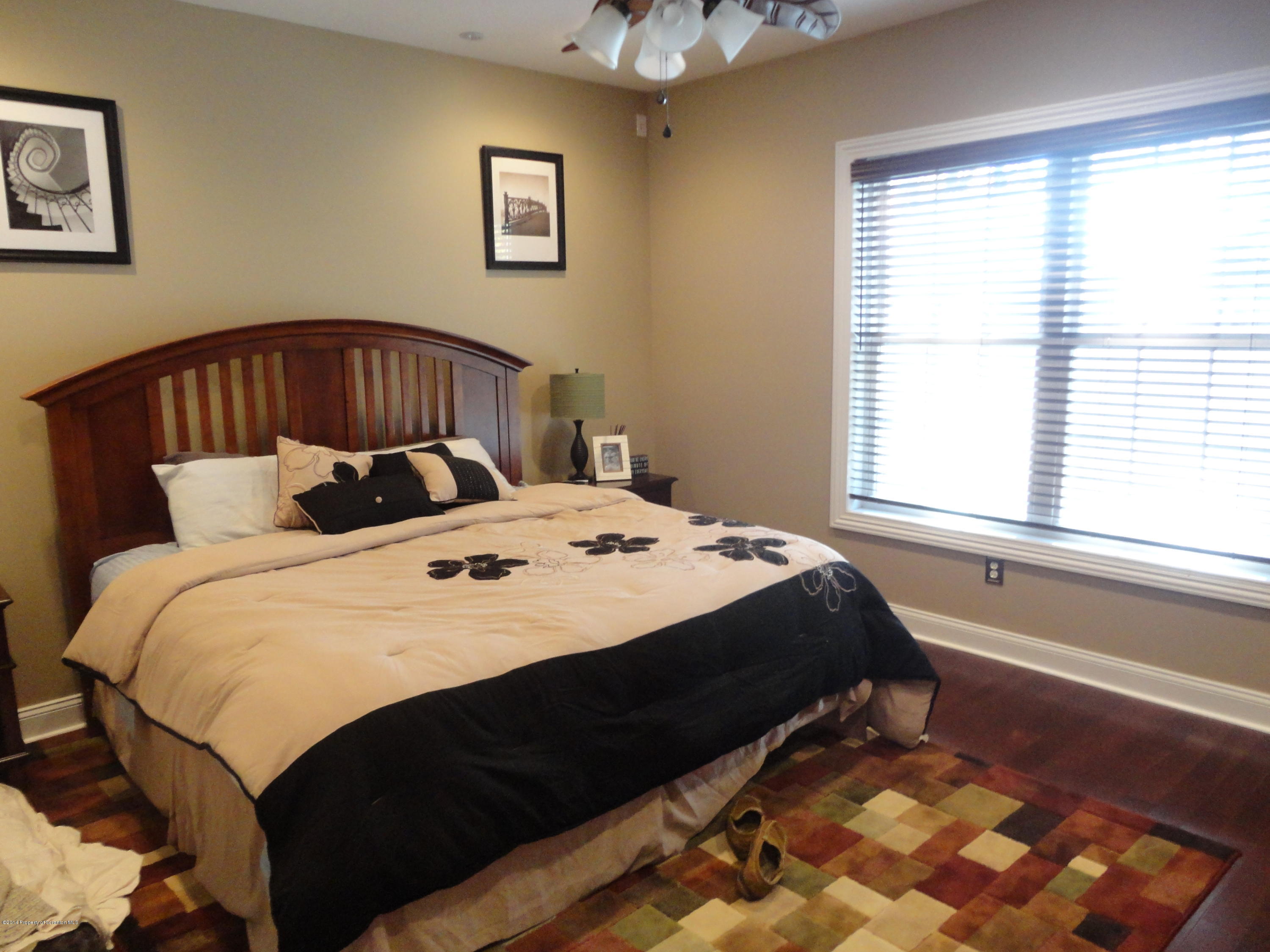 910 Line Road Lake Ariel, PA 18436 - Photo 31 of 48 a bedroom with a bed and a window