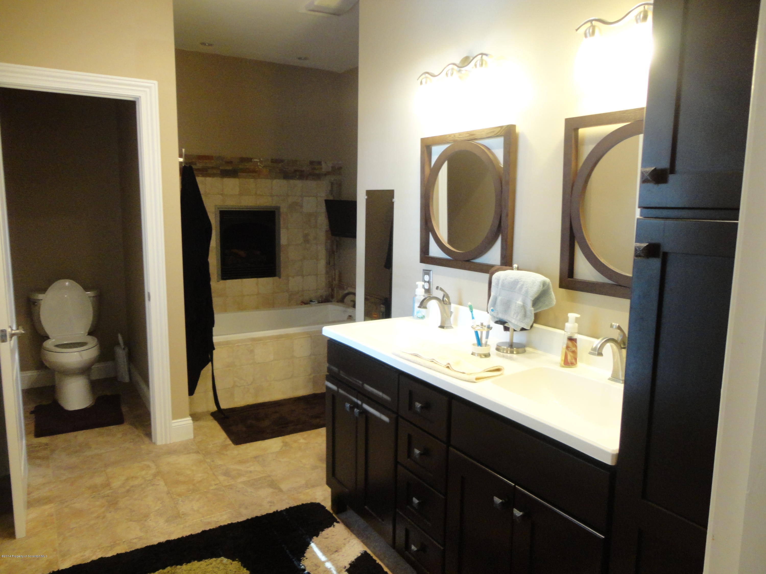 910 Line Road Lake Ariel, PA 18436 - Photo 32 of 48 a en suite bathroom with a sink and a mirror