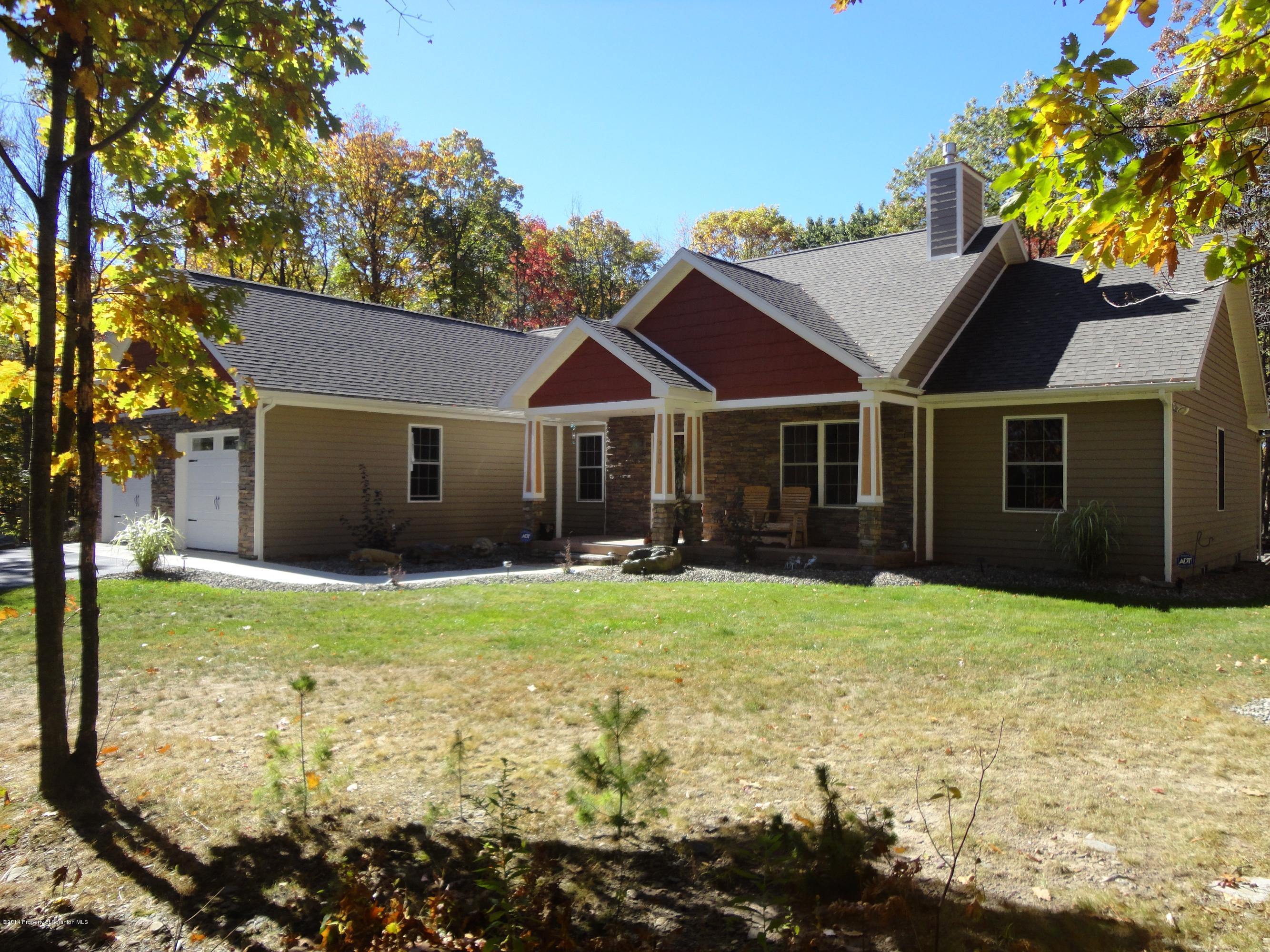 910 Line Road Lake Ariel, PA 18436 - Photo 4 of 48 a house with garden in front of it