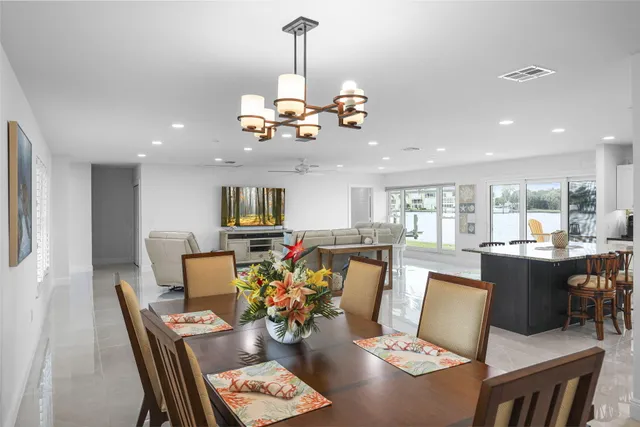 a kitchen with granite countertop a sink a stove and cabinets