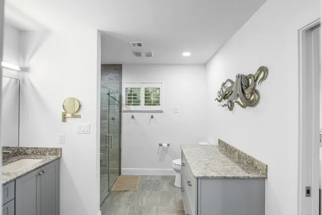 a utility room with dryer washer and a window