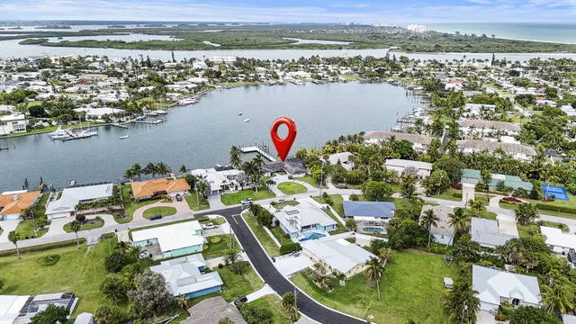 an aerial view of a house with outdoor space patio and swimming pool