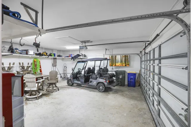 an aerial view of a house with swimming pool and lake view