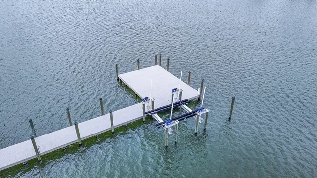 an aerial view of a house with a lake view
