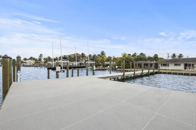 an aerial view of a house with a lake view