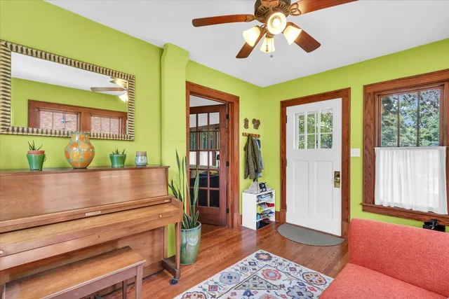 a view of room with window and ceiling fan