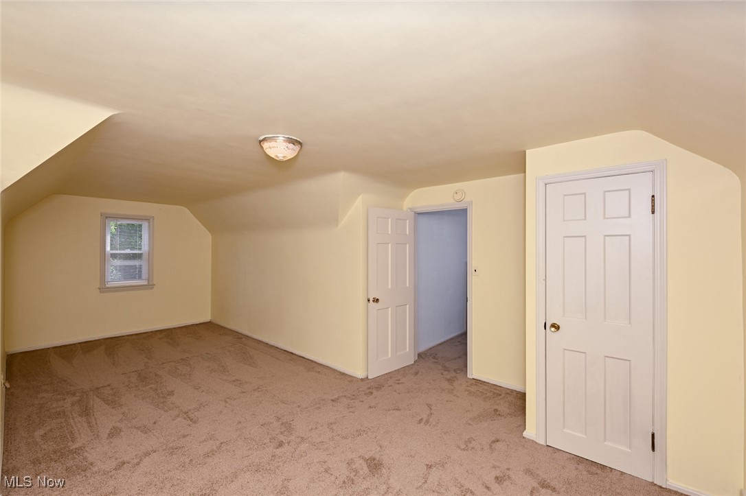 4033 Wyncote Road South Euclid, OH 44121 - Photo 16 of 25 Additional living space featuring vaulted ceiling and light carpet