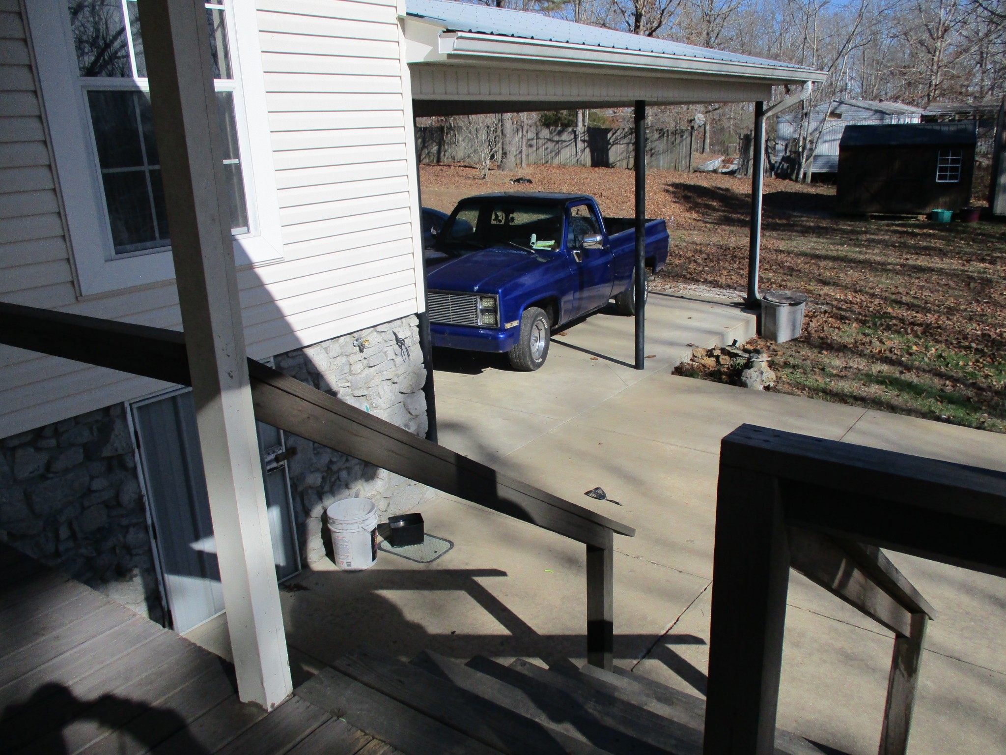 908 Bear Cub Run Centerville, TN 37033 - Photo 11 of 17 a backyard of a house with barbeque oven table and chairs
