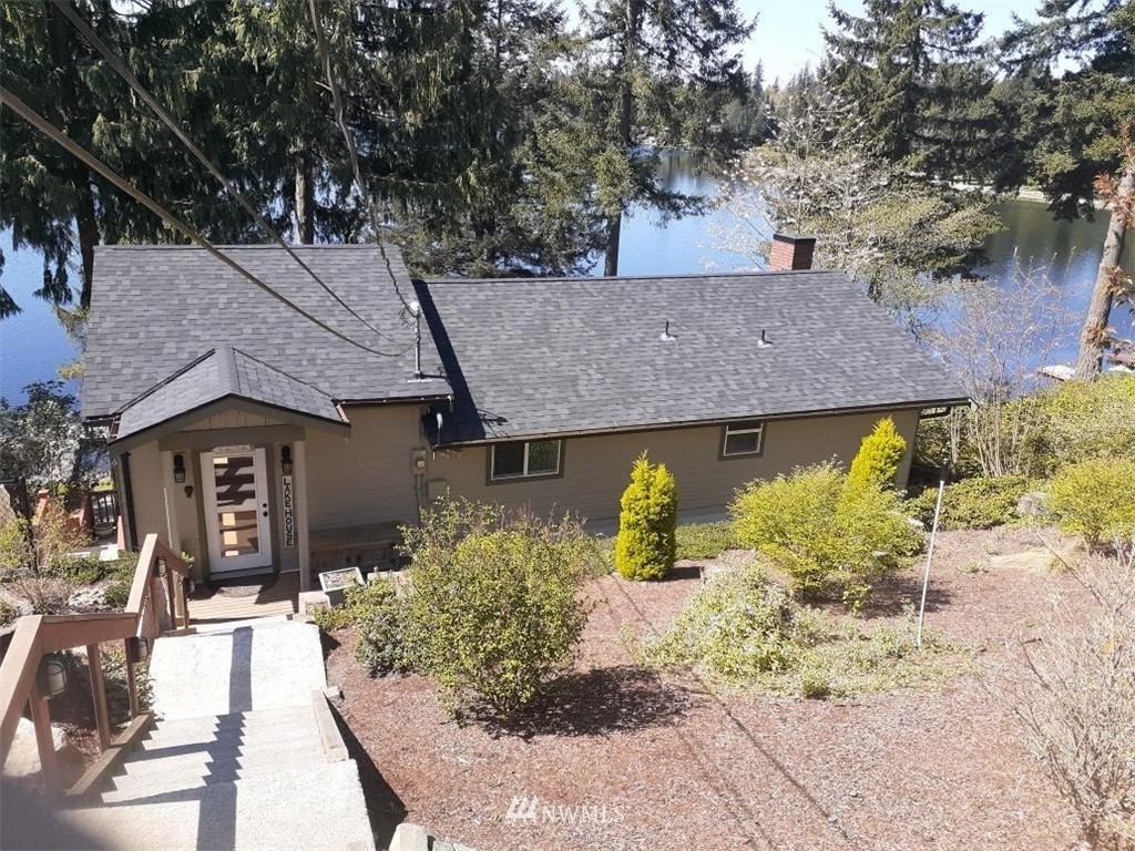 5124 Weber Road Snohomish, WA 98290 - Photo 1 of 1 a front view of a house with a yard and a garden