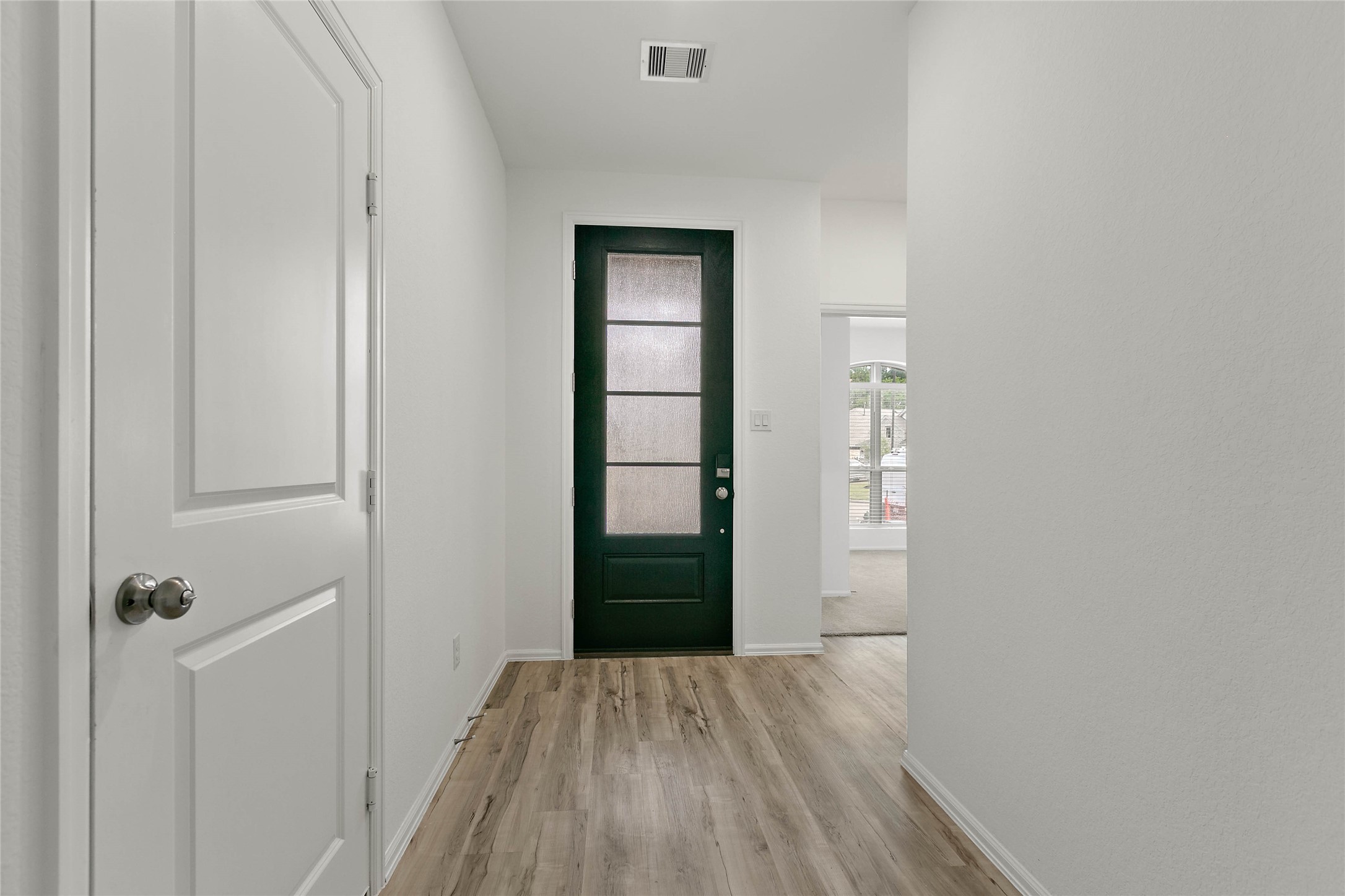 7602 Angels Lndg Lane Porter, TX 77365 - Photo 3 of 32 Welcoming wood like flooring greets you as you enter.