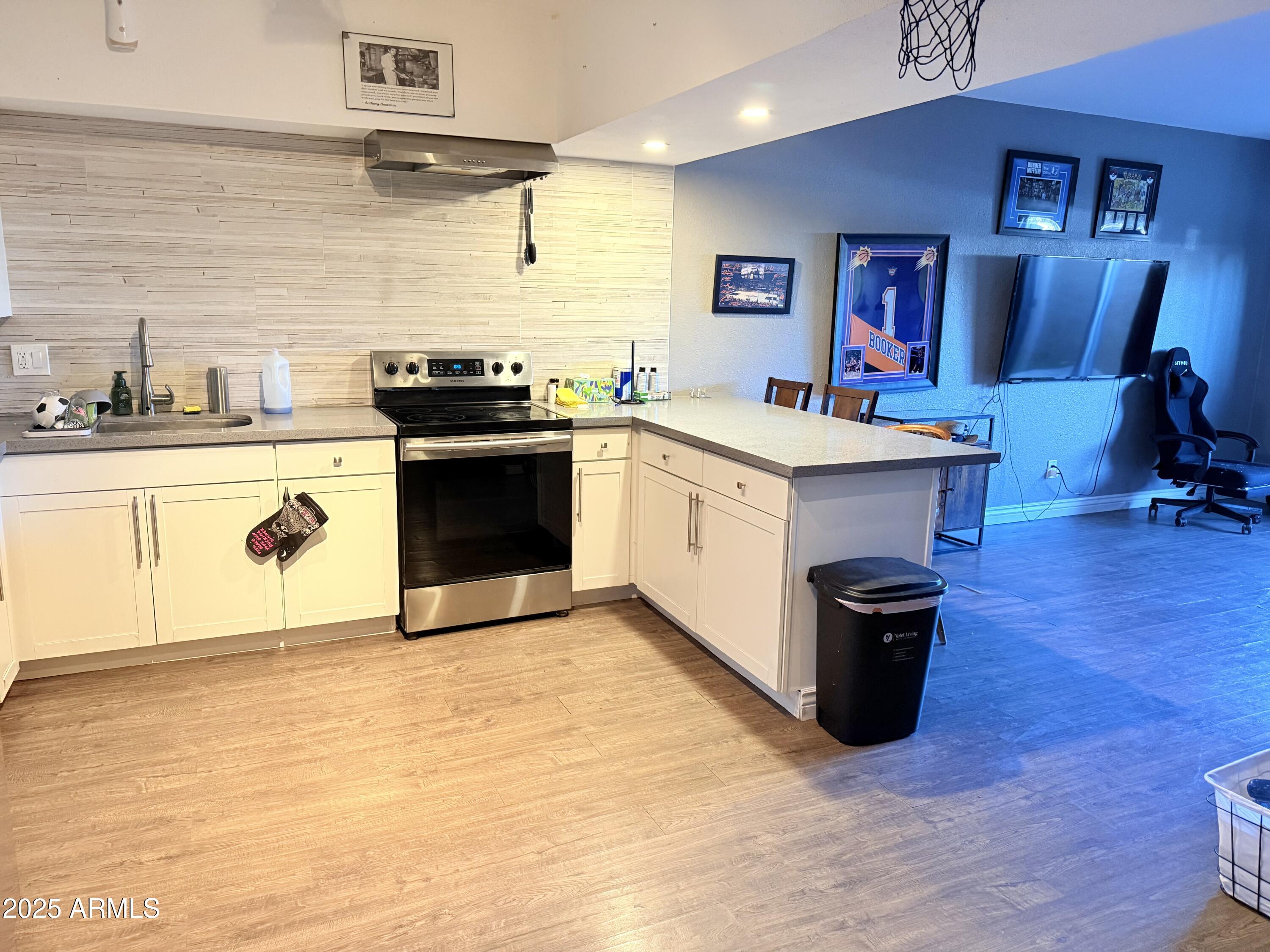 357 East Thomas Road, Unit A105 Phoenix, AZ 85012 - Photo 12 of 51 a kitchen with stainless steel appliances granite countertop a stove a sink dishwasher and a refrigerator