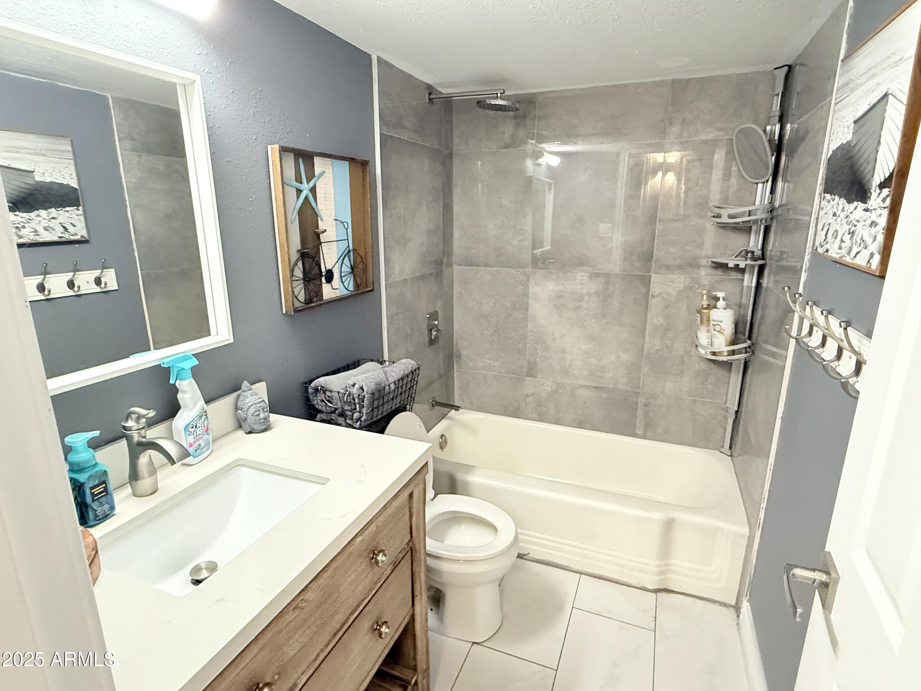 357 East Thomas Road, Unit A105 Phoenix, AZ 85012 - Photo 20 of 51 a bathroom with a sink a toilet and shower