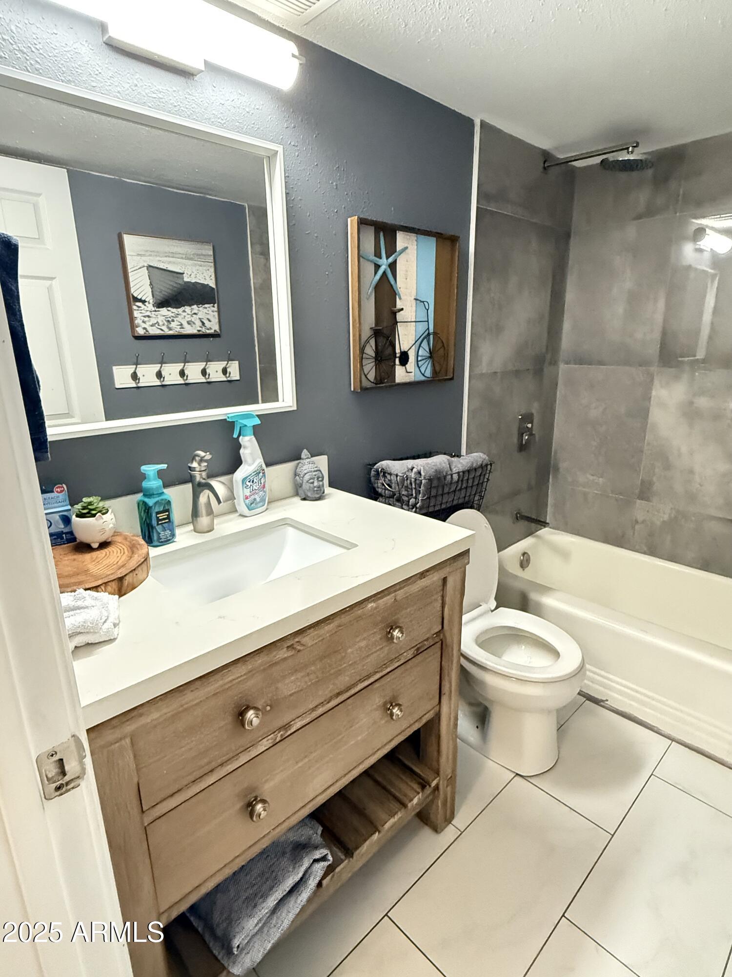 357 East Thomas Road, Unit A105 Phoenix, AZ 85012 - Photo 21 of 51 a bathroom with a sink a toilet and shower