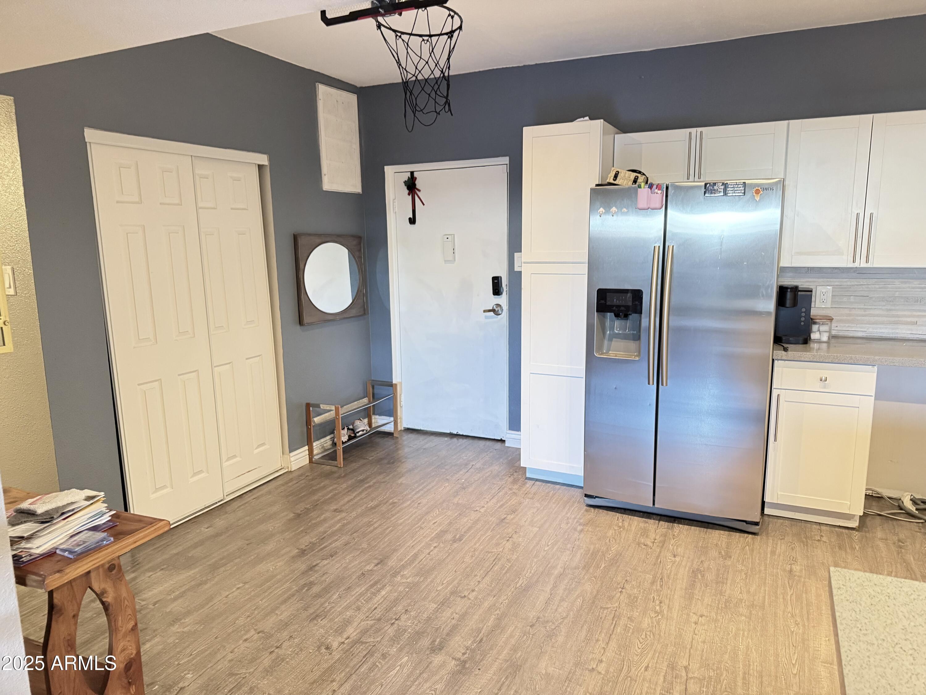 357 East Thomas Road, Unit A105 Phoenix, AZ 85012 - Photo 3 of 51 a area with wooden floor and closet