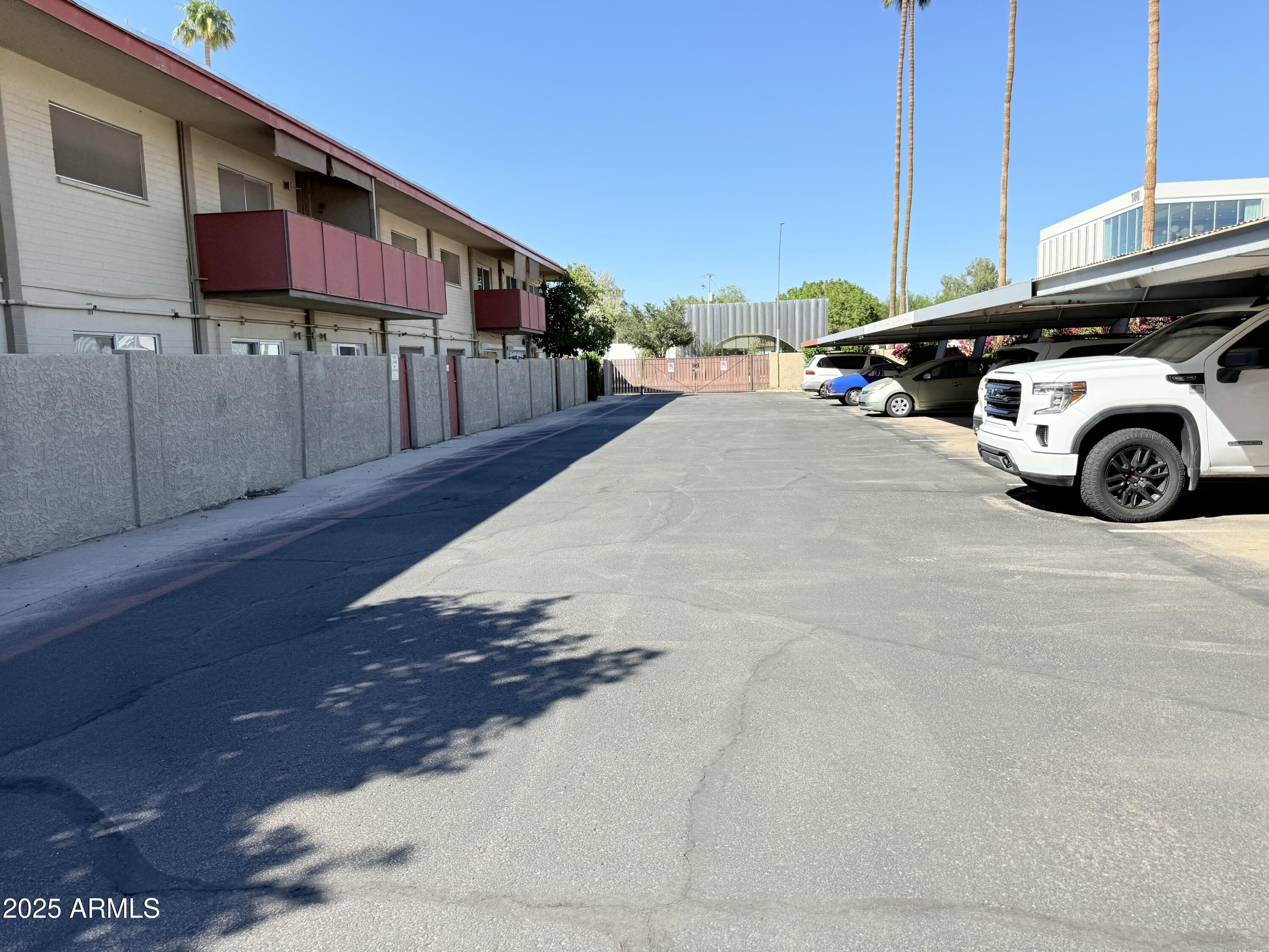357 East Thomas Road, Unit A105 Phoenix, AZ 85012 - Photo 34 of 51 a view of a car park in front of house