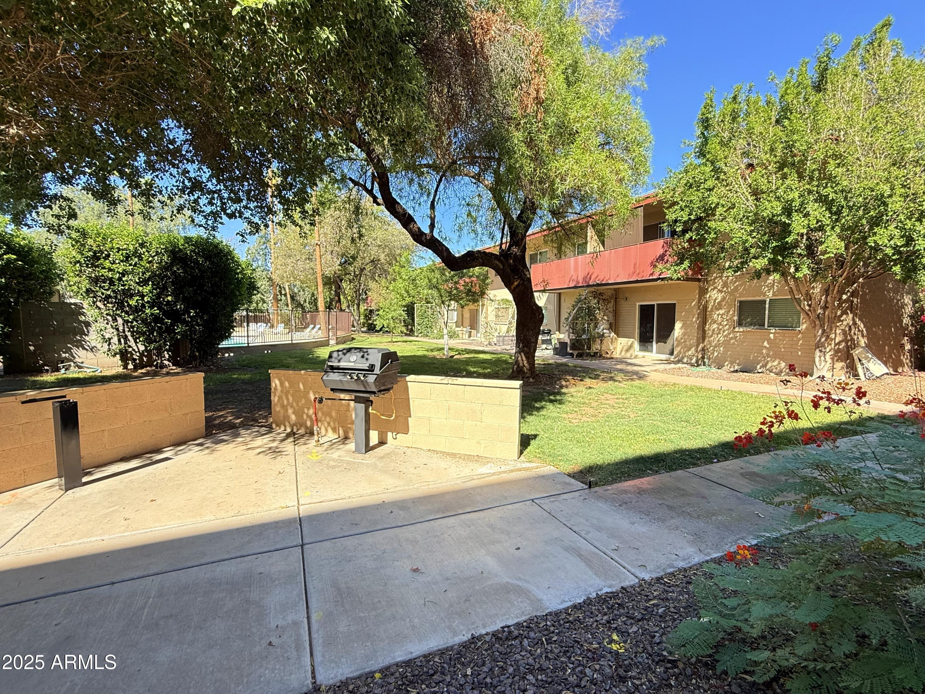 357 East Thomas Road, Unit A105 Phoenix, AZ 85012 - Photo 39 of 51 a view of a swimming pool with a patio
