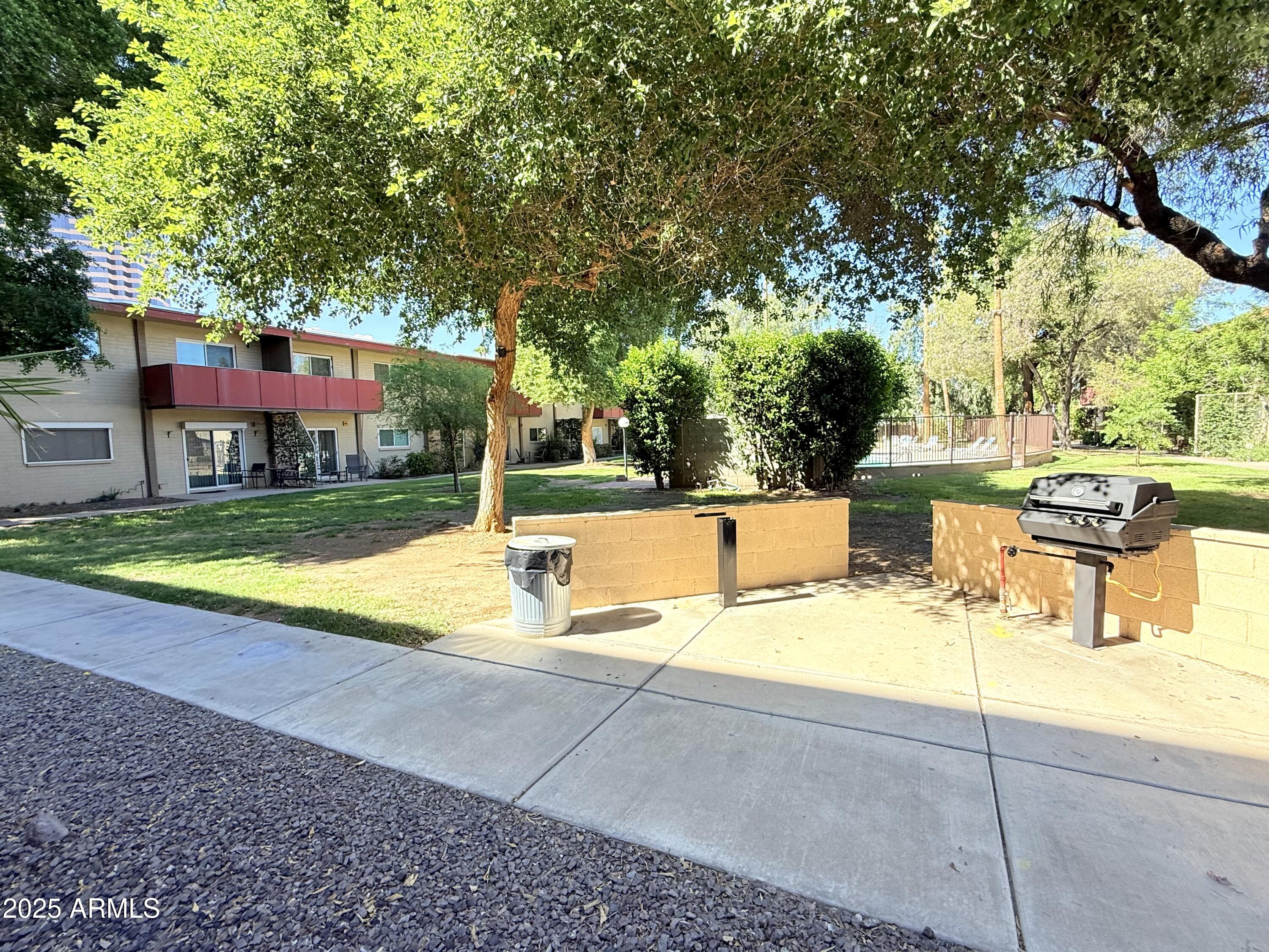 357 East Thomas Road, Unit A105 Phoenix, AZ 85012 - Photo 40 of 51 a view of a swimming pool with a patio